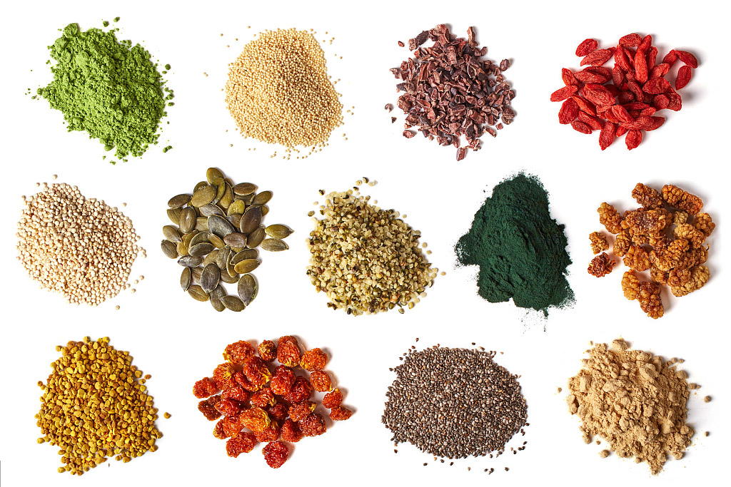 Various superfoods isolated on white background